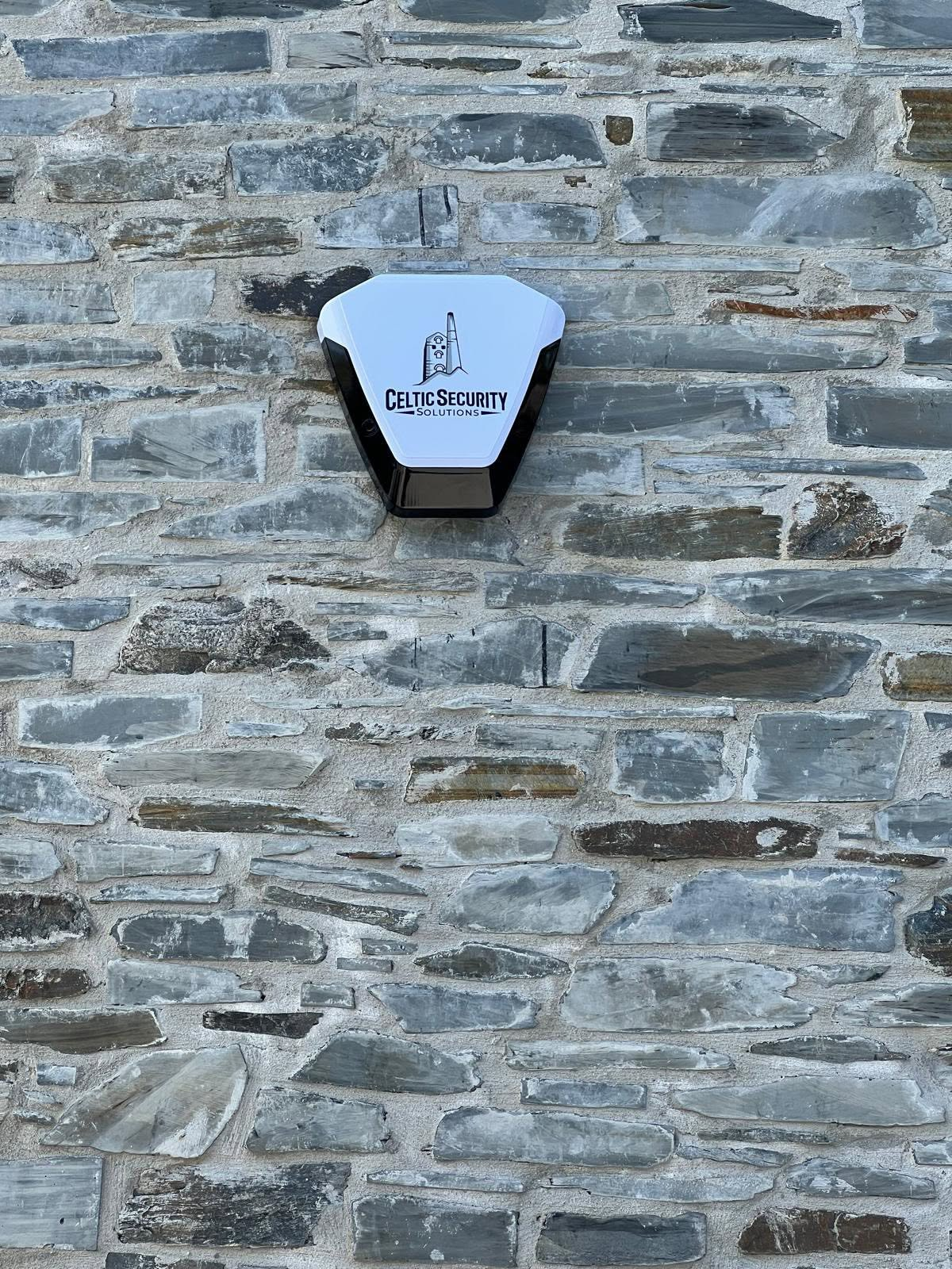 Celtic Security Solutions alarm bell box installed on a Cornish slate stone wall