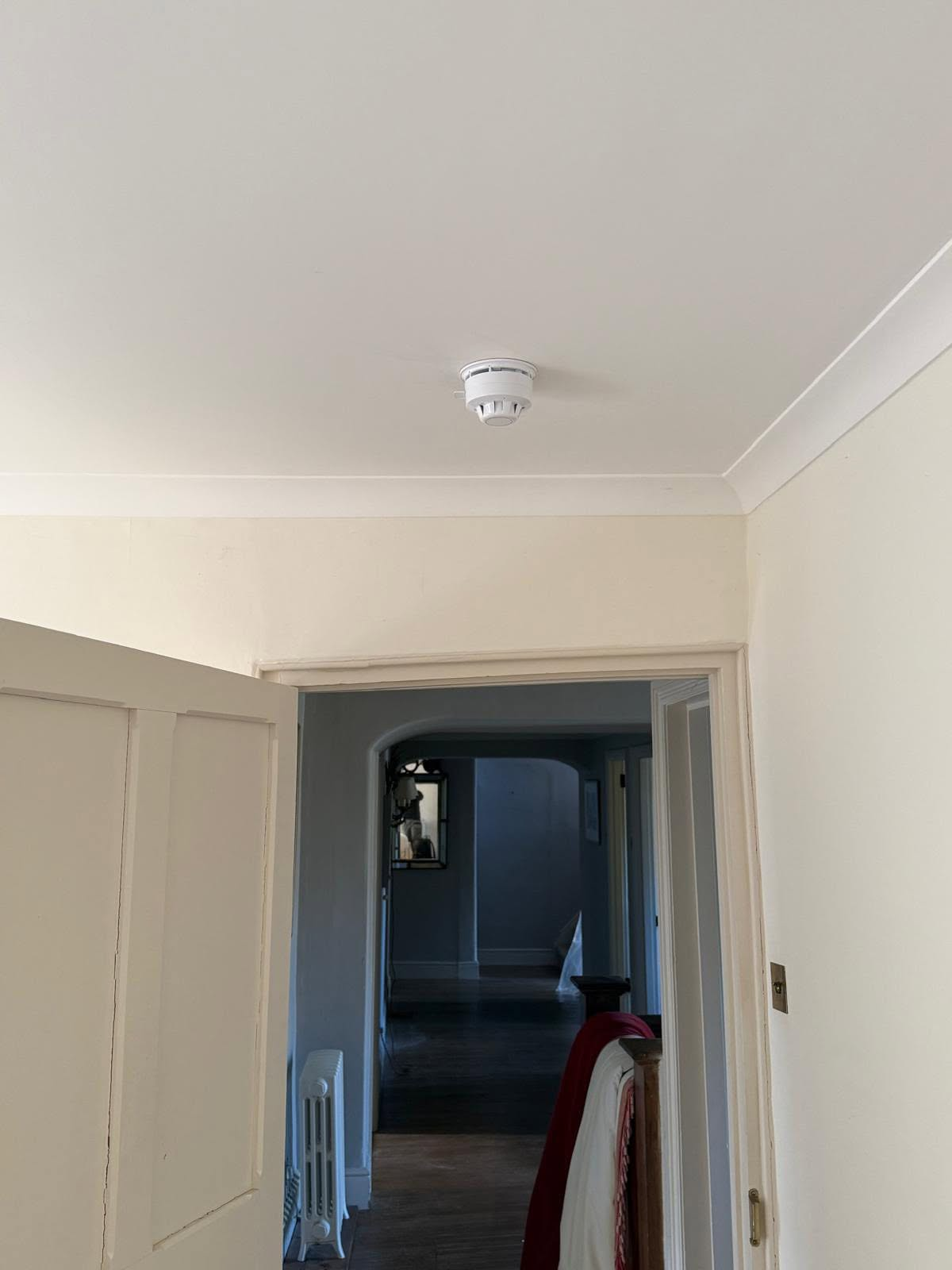 Smoke detector installed by Celtic Security Solutions in a period Cornish cottage hallway